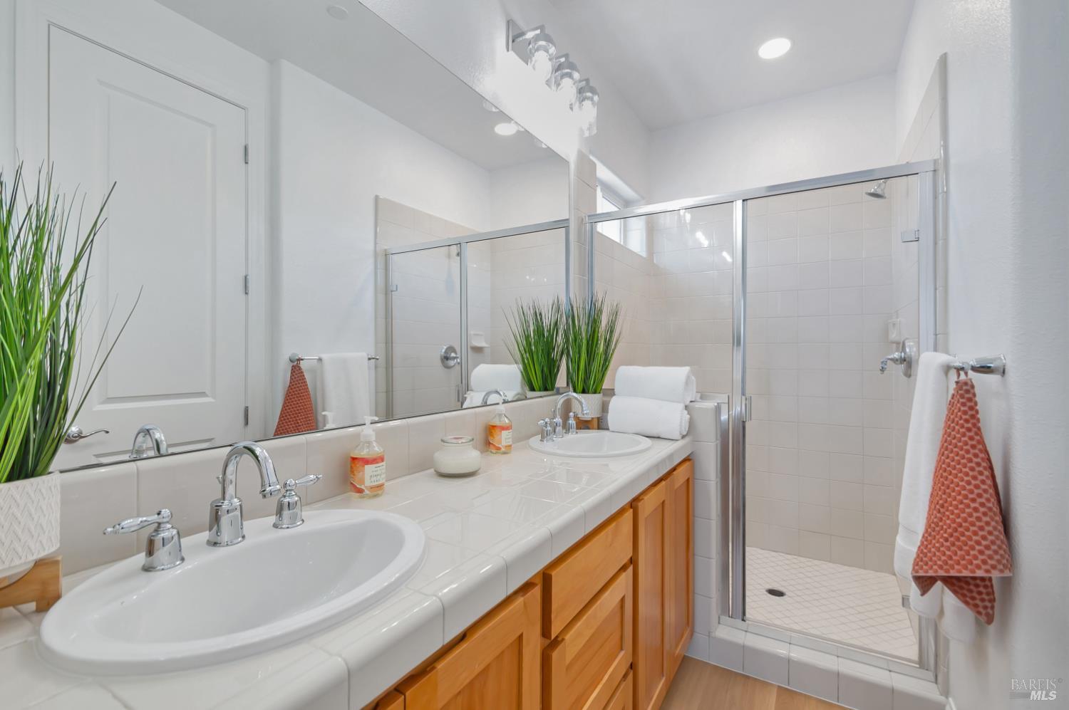 4242 Streamside Drive Santa Rosa, CA 95409 - Photo 24 of 29 a bathroom with a double vanity sink and a mirror