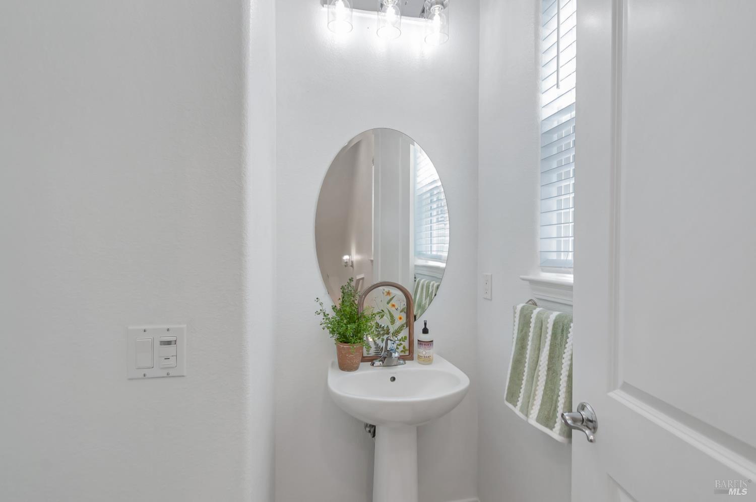 4242 Streamside Drive Santa Rosa, CA 95409 - Photo 7 of 29 a bathroom with a sink and a mirror