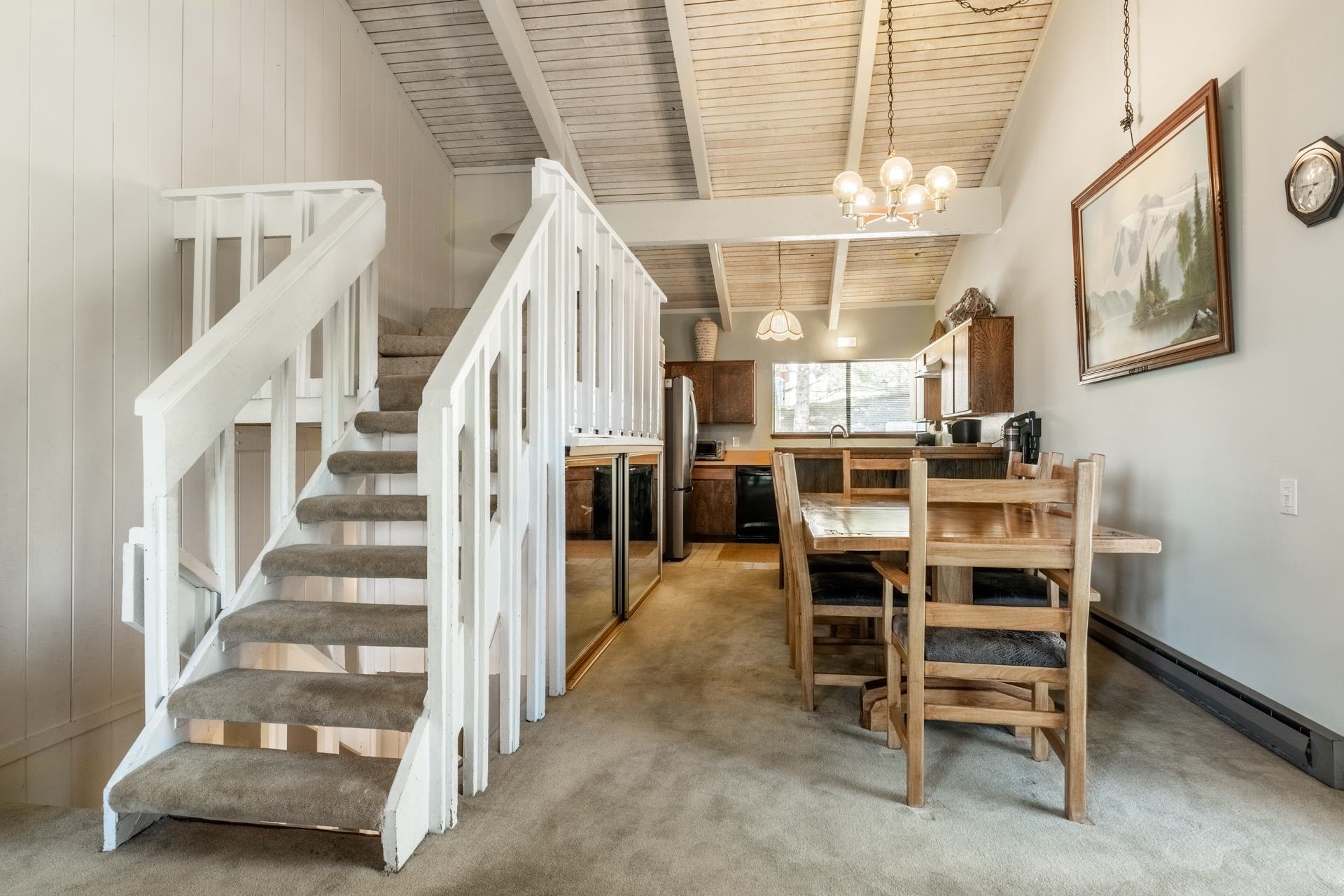 94 John Muir Road, Unit 132 Mammoth Lakes, CA 93546 - Photo 11 of 58 Carpeted staircase with white balusters leading to an upper level