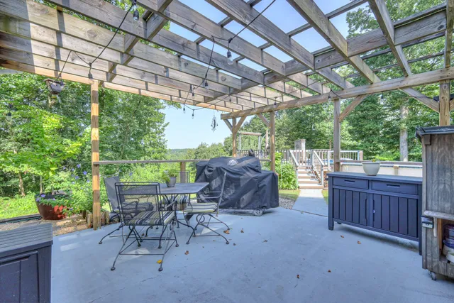 a view of balcony with wooden floor and seating space