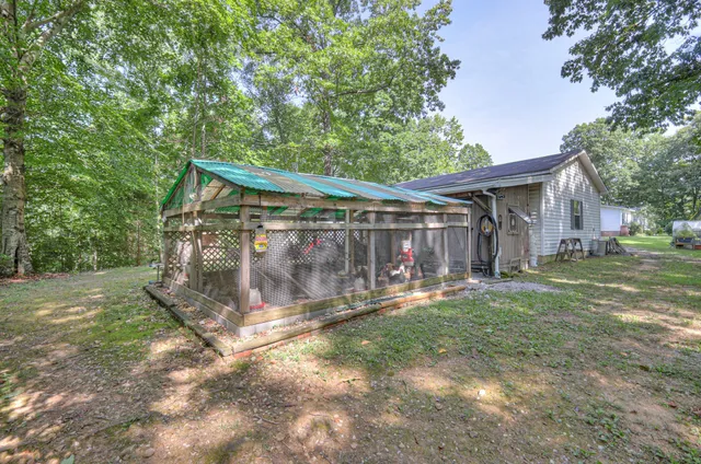 a view of a yard with swimming pool
