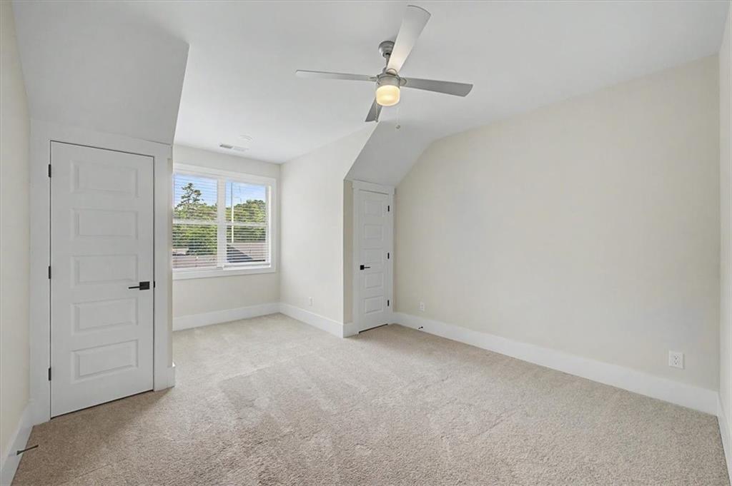 217 Laura Lake Road Marietta, GA 30066 - Photo 41 of 54 an empty room with a ceiling fan and a window