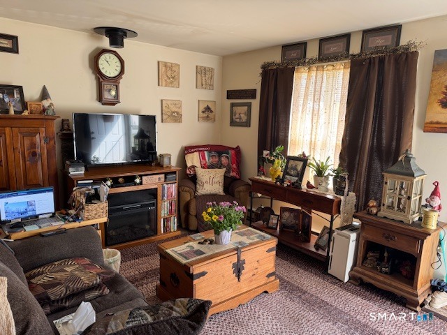 39 Courtney Lane Killingly, CT 06241 - Photo 2 of 10 a living room with furniture a window and a flat screen tv