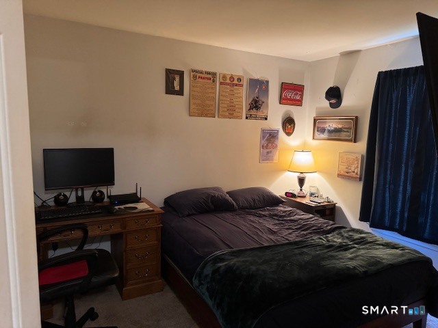 39 Courtney Lane Killingly, CT 06241 - Photo 7 of 10 a bedroom with a bed and a flat screen tv