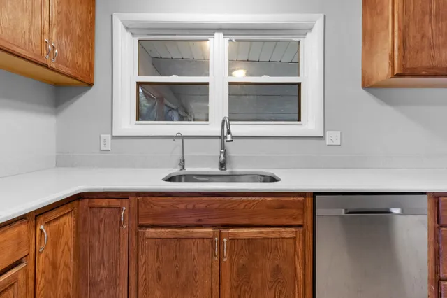 a close view of sink and cabinets