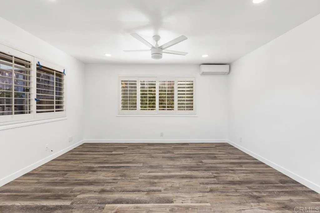 889 Bracero Road Encinitas, CA 92024 - Photo 33 of 59 a view of empty room with wooden floor and fan