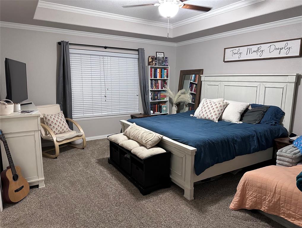 1212 Bowman Ridge Road Stephenville, TX 76401 - Photo 18 of 23 a bedroom with a bed and a couch