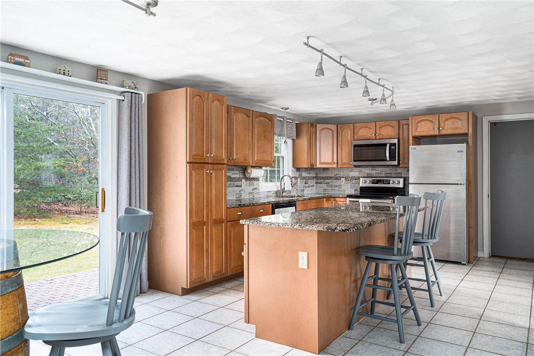 90 Stillwater Road Charlestown, RI 02813 - Photo 5 of 37 Renovated kitchen with granite countertops and stainless appliances