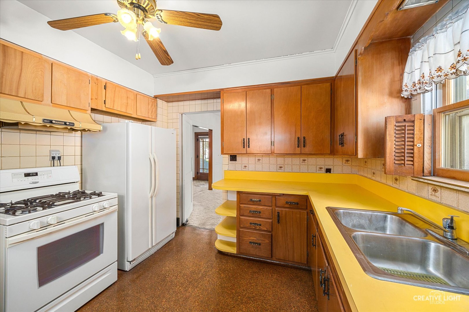 363 Orchard Street Elgin, IL 60123 - Photo 11 of 27 a kitchen with a sink appliances and cabinets