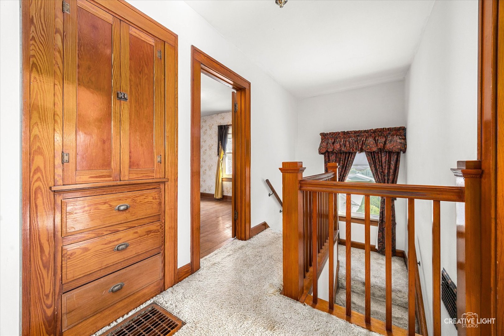 363 Orchard Street Elgin, IL 60123 - Photo 12 of 27 a view of a hallway with wooden floor and windows