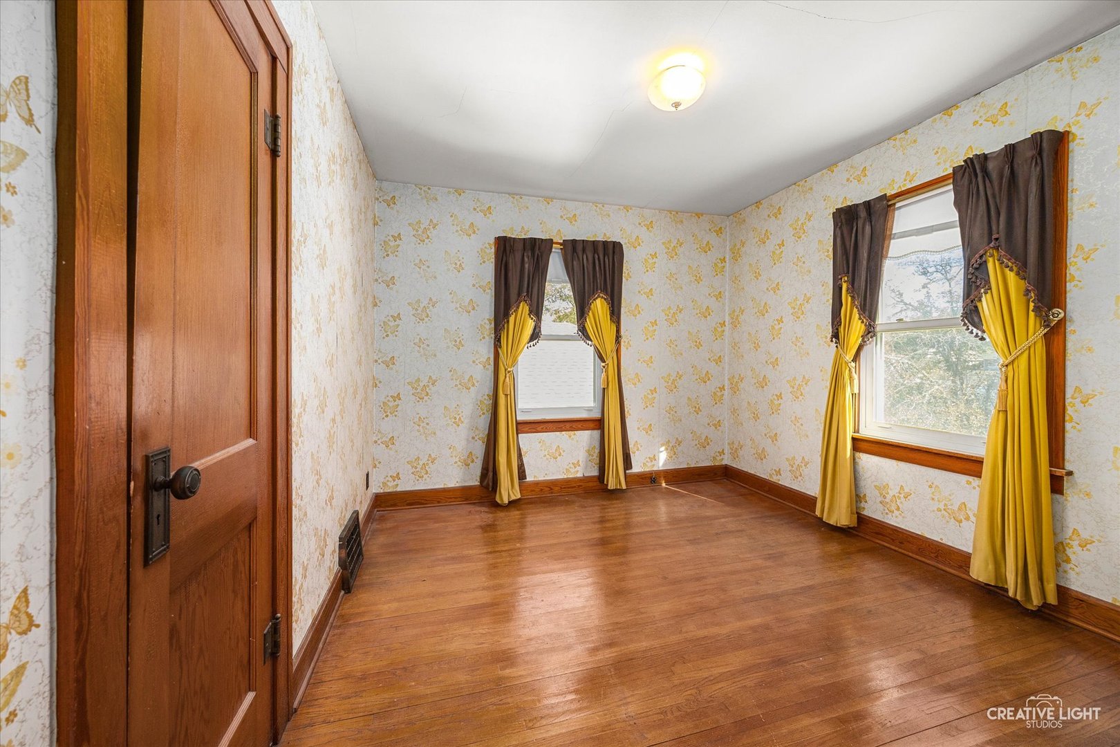363 Orchard Street Elgin, IL 60123 - Photo 13 of 27 wooden floor in an empty room with a window