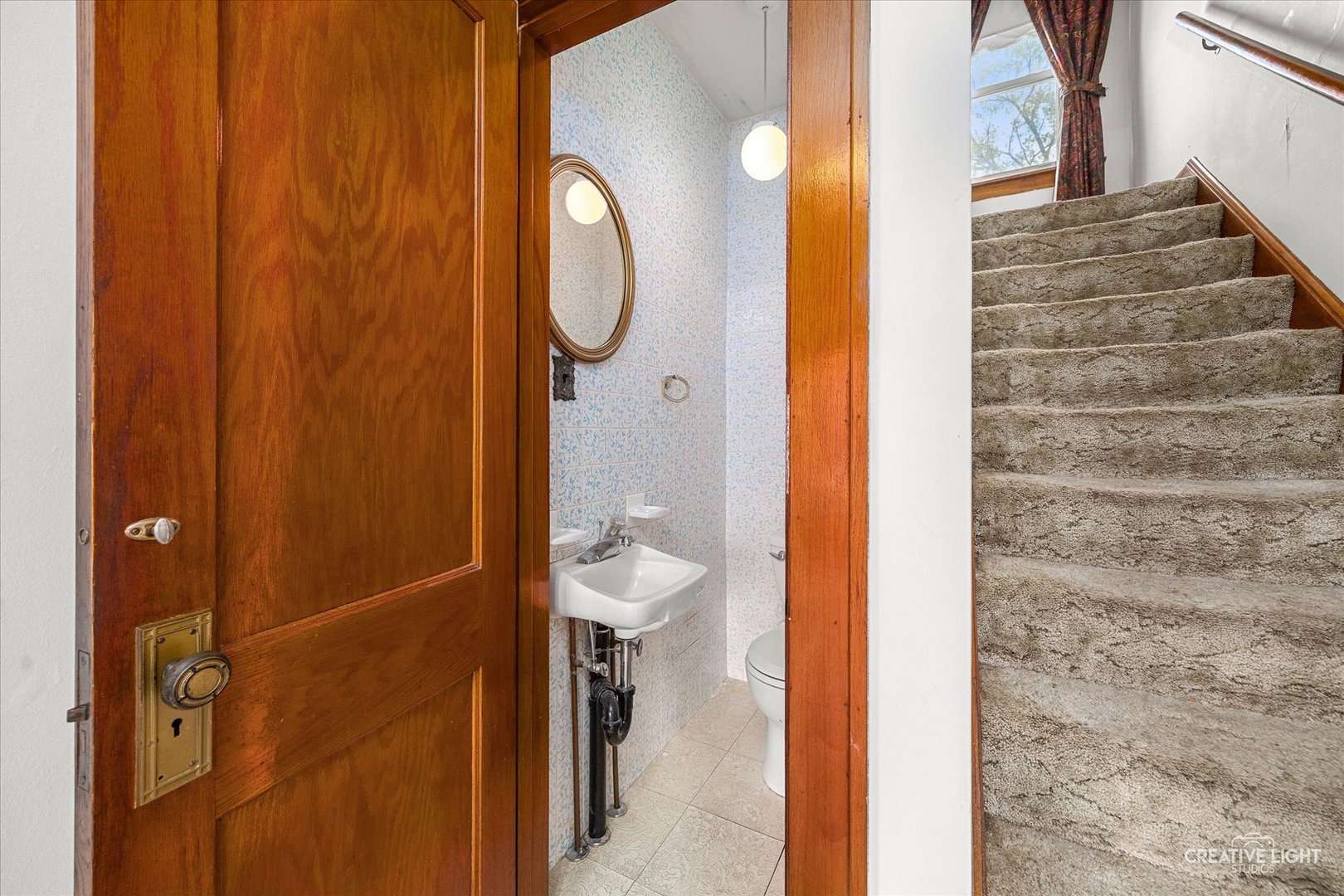 363 Orchard Street Elgin, IL 60123 - Photo 9 of 27 a bathroom with a sink and a mirror