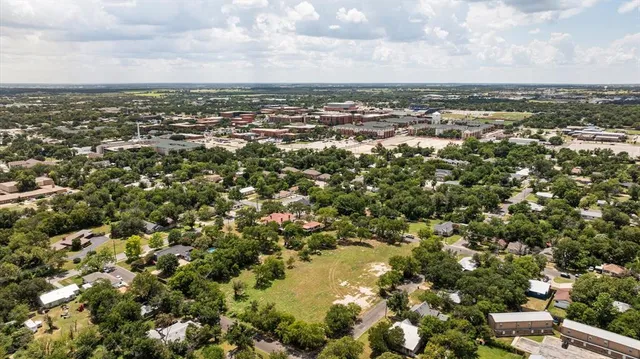 an aerial view of a city with lots of residential buildings