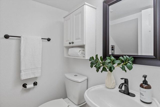 a bedroom with a large bed and a tv