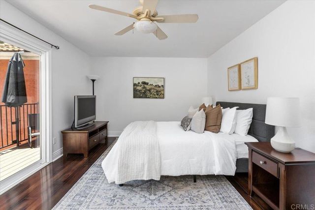 a view of balcony with furniture and wooden floor