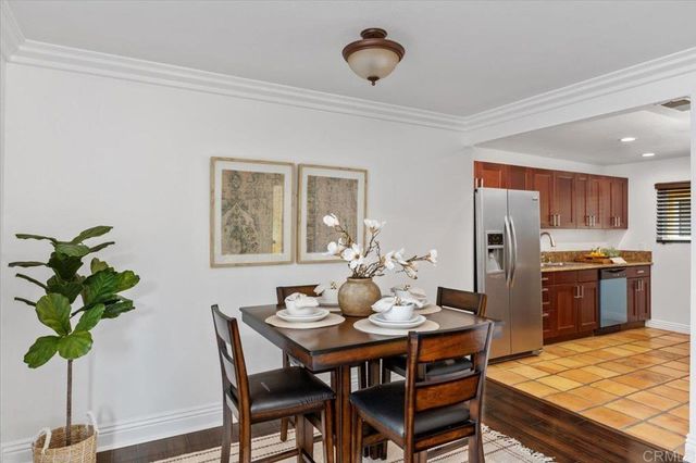 a kitchen with stainless steel appliances granite countertop a refrigerator and a stove