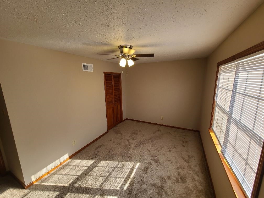 3478 Cane Ridge Drive Memphis, TN 38109 - Photo 9 of 19 a view of a livingroom with a ceiling fan and window