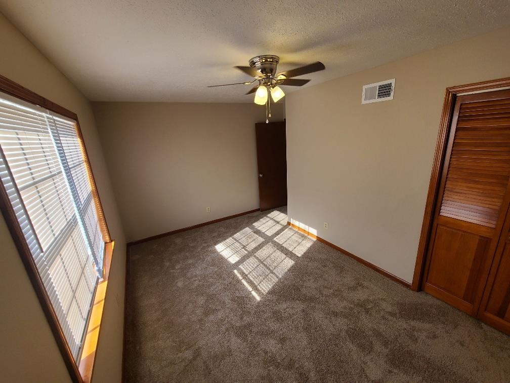 3478 Cane Ridge Drive Memphis, TN 38109 - Photo 10 of 19 a view of an empty room with a window