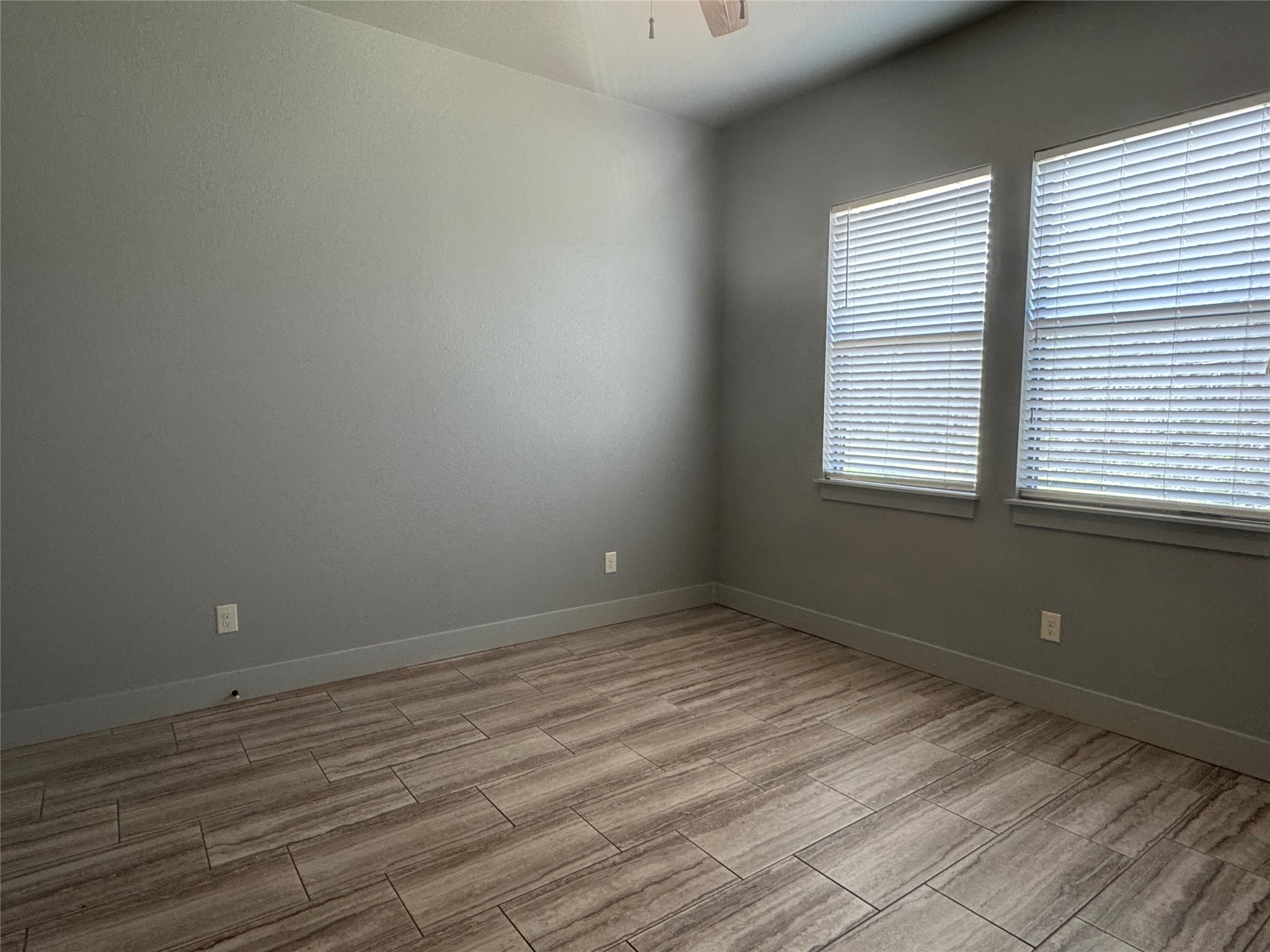 290 Hugo Road, Unit B San Marcos, TX 78666 - Photo 14 of 22 a view of an empty room with wooden floor and a window