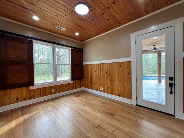 9490 Highway 196 Collierville, TN 38017 - Photo 11 of 39 Dining room with wood walls, wainscoting, light wood finished floors, wood ceiling, and recessed lighting