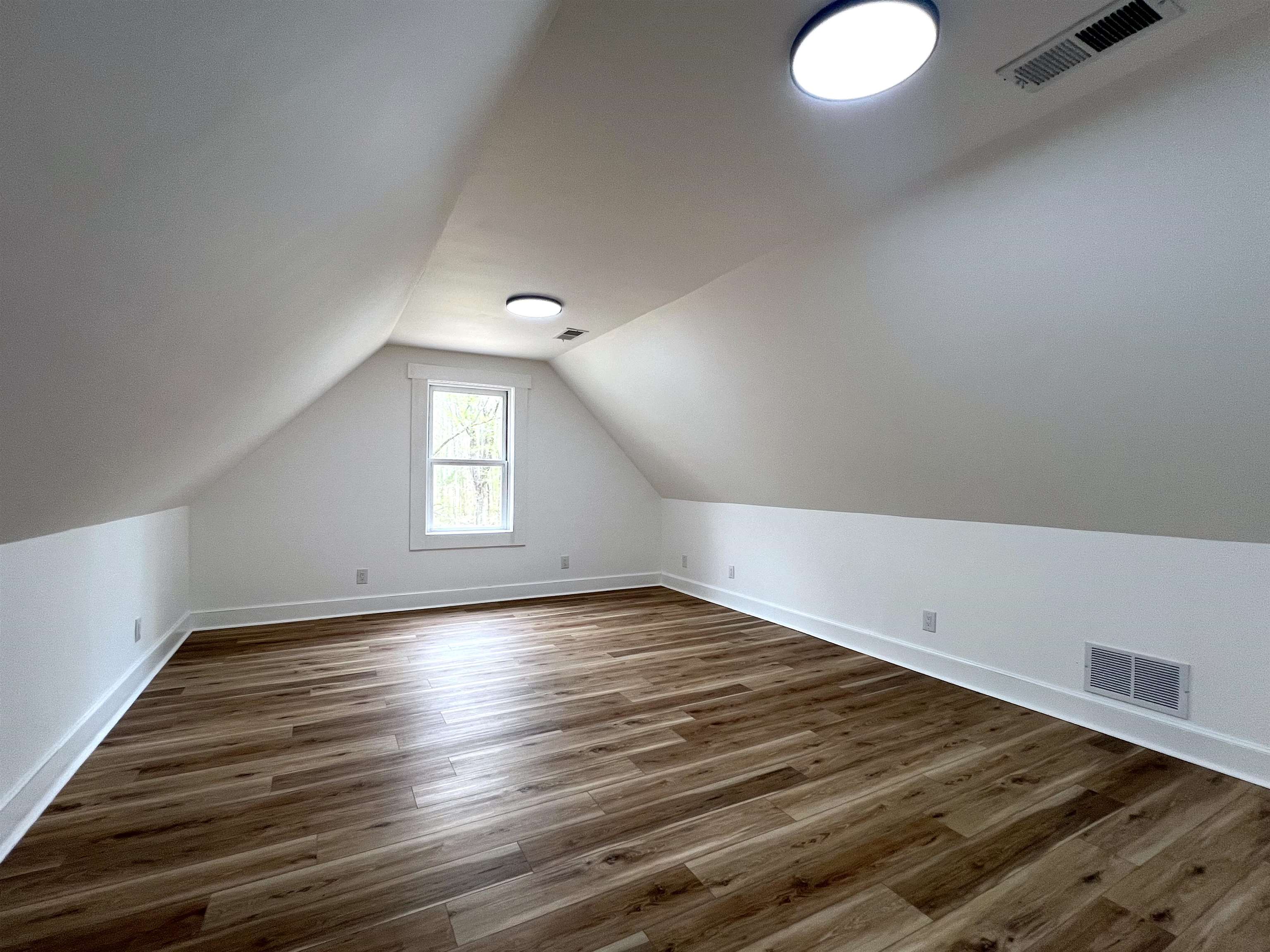 9490 Highway 196 Collierville, TN 38017 - Photo 30 of 39 Bedroom three with dark wood-type flooring and baseboards