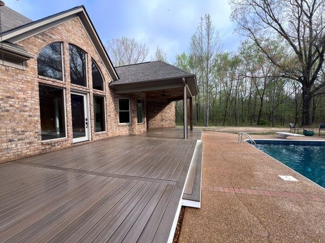 9490 Highway 196 Collierville, TN 38017 - Photo 36 of 39 Deck featuring an outdoor pool and a ceiling fan