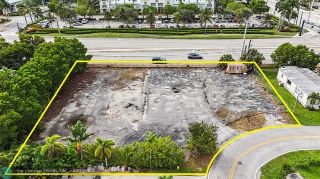 a view of swimming pool with a yard and plants