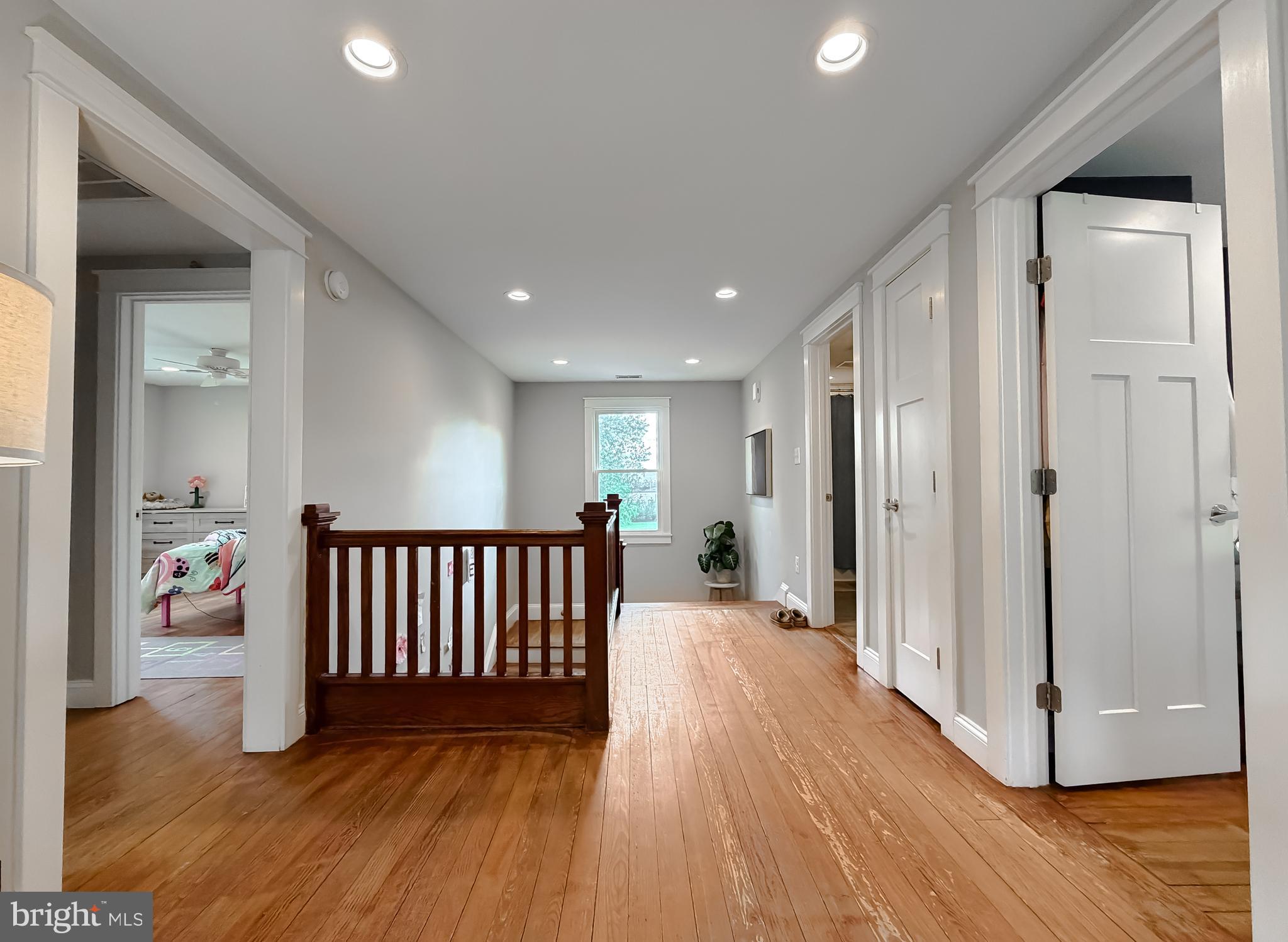 16146 Thomas Road Piney Point, MD 20674 - Photo 17 of 57 a view of a hallway with wooden floor and door
