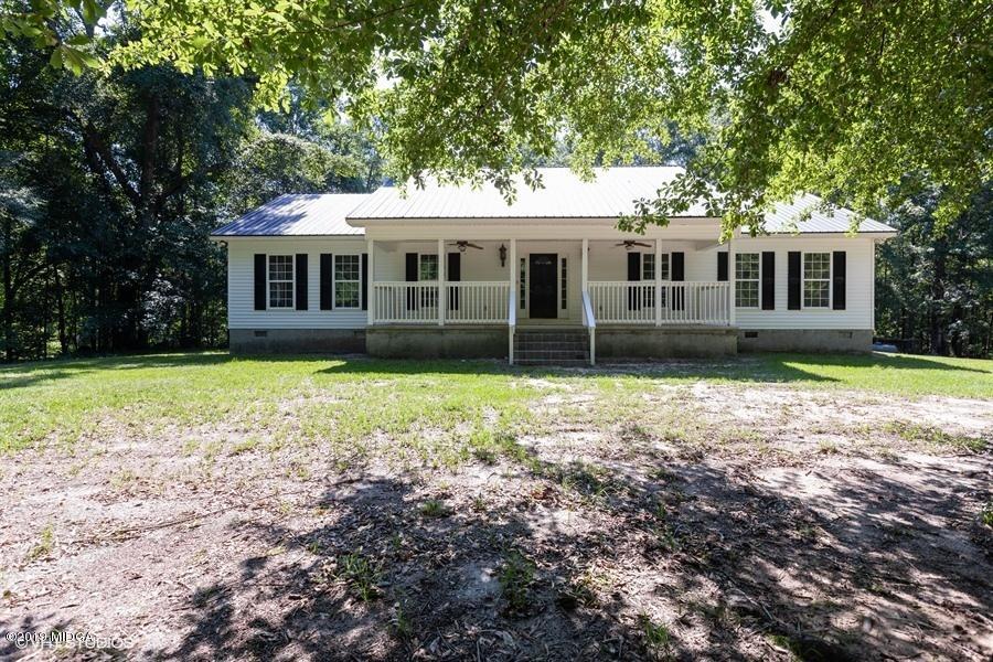 4071 Hollis Road Roberta, GA 31078 - Photo 1 of 22 a front view of house with yard and green space