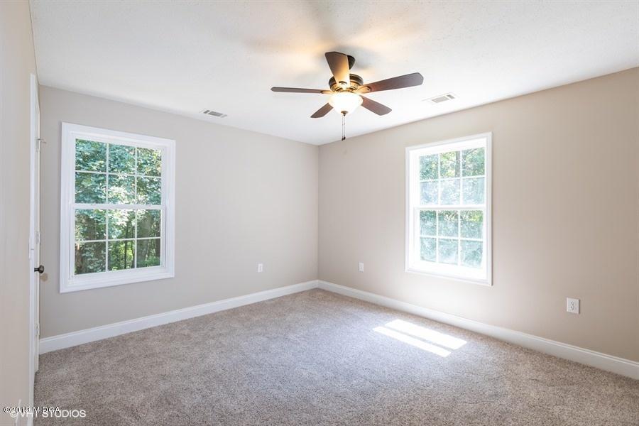4071 Hollis Road Roberta, GA 31078 - Photo 16 of 22 an empty room with windows and fan