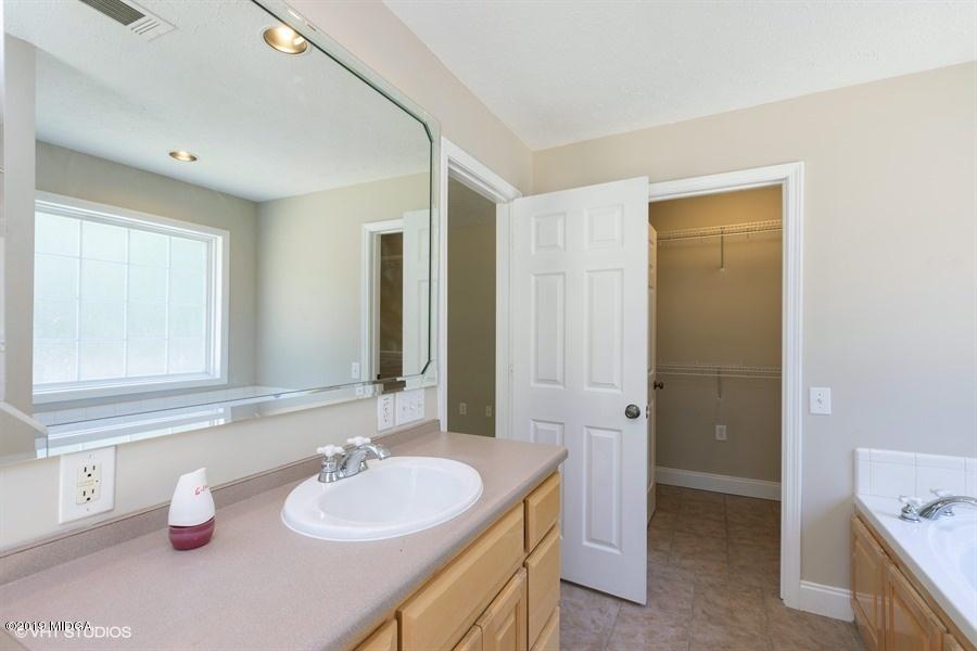 4071 Hollis Road Roberta, GA 31078 - Photo 21 of 22 a bathroom with a granite countertop sink and a mirror