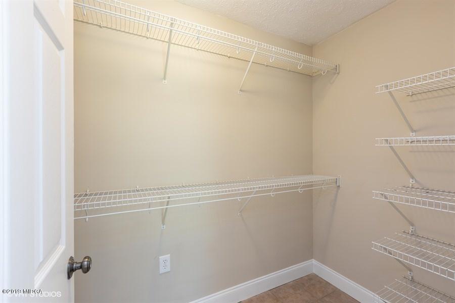 4071 Hollis Road Roberta, GA 31078 - Photo 22 of 22 a view of a room with racks on the wall