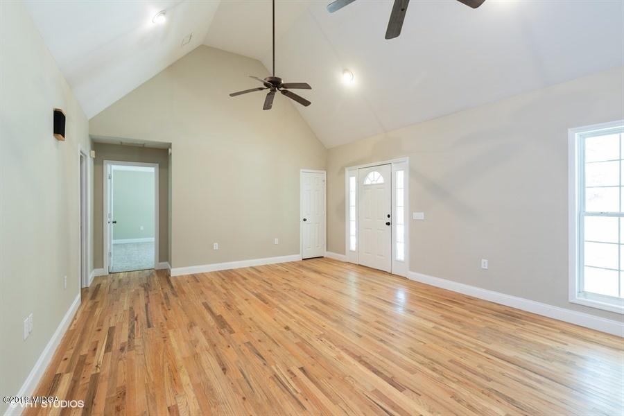 4071 Hollis Road Roberta, GA 31078 - Photo 4 of 22 a view of empty room with wooden floor and fan