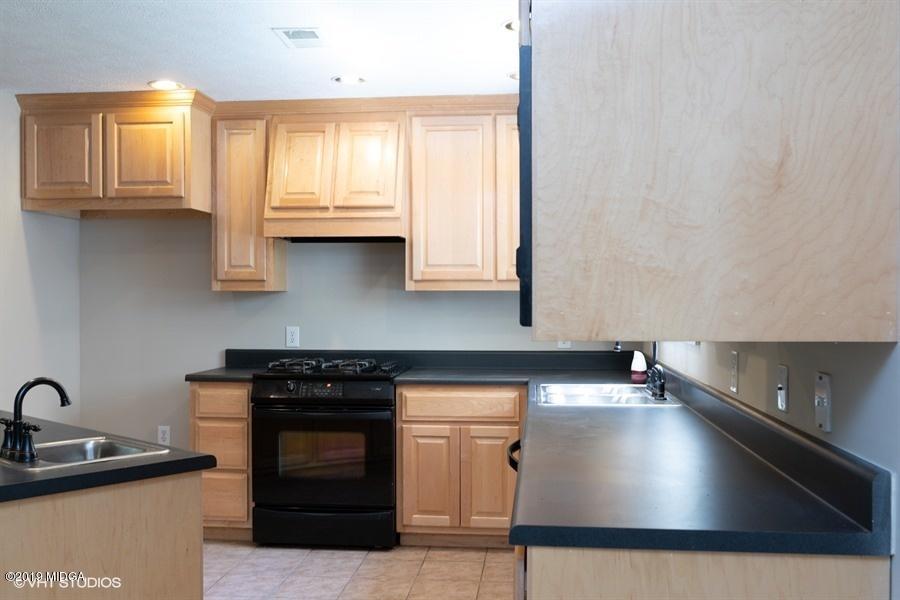 4071 Hollis Road Roberta, GA 31078 - Photo 9 of 22 a kitchen with stainless steel appliances granite countertop a sink stove and cabinets