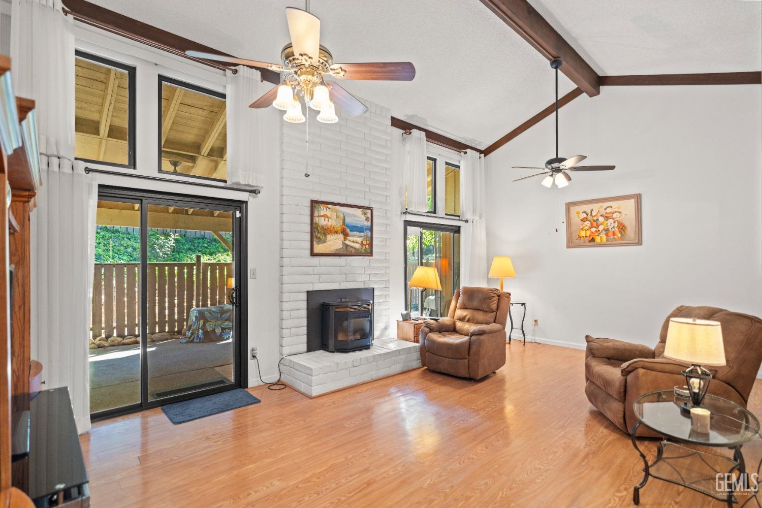 Undisclosed Address Bakersfield, CA 93306 - Photo 11 of 56 a living room with furniture and a fireplace