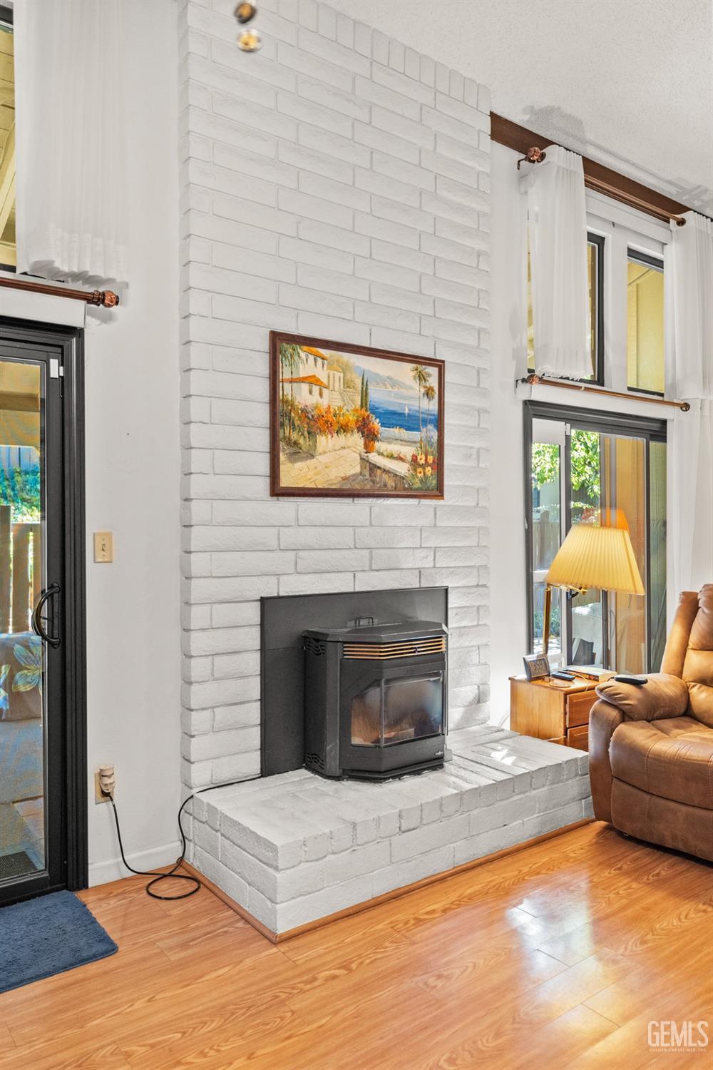 Undisclosed Address Bakersfield, CA 93306 - Photo 12 of 56 a living room with furniture and a fireplace