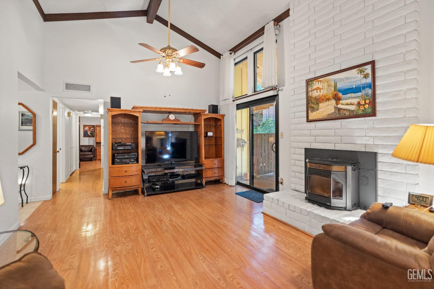 Undisclosed Address Bakersfield, CA 93306 - Photo 14 of 56 a living room with furniture and a fireplace