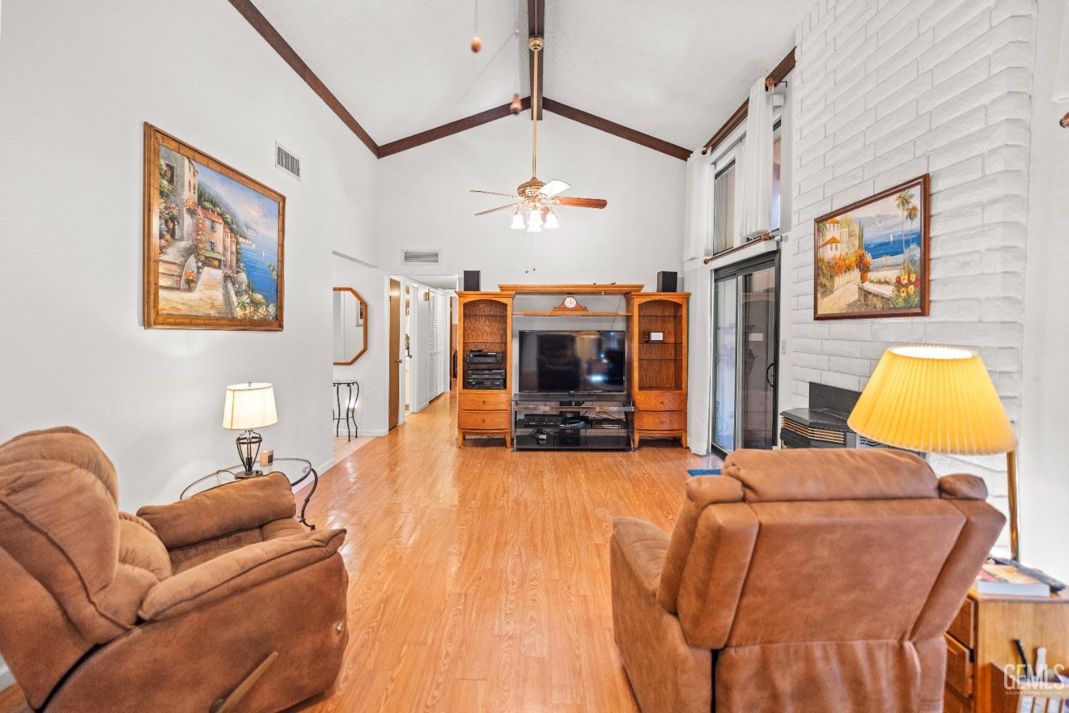 Undisclosed Address Bakersfield, CA 93306 - Photo 15 of 56 a living room with furniture and a flat screen tv