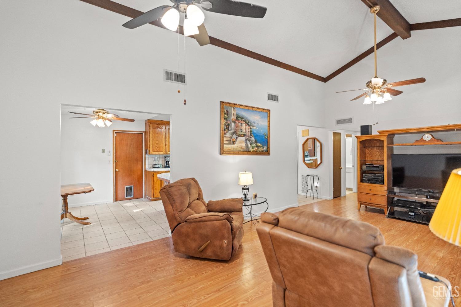 Undisclosed Address Bakersfield, CA 93306 - Photo 17 of 56 a living room with furniture a flat screen tv and a window