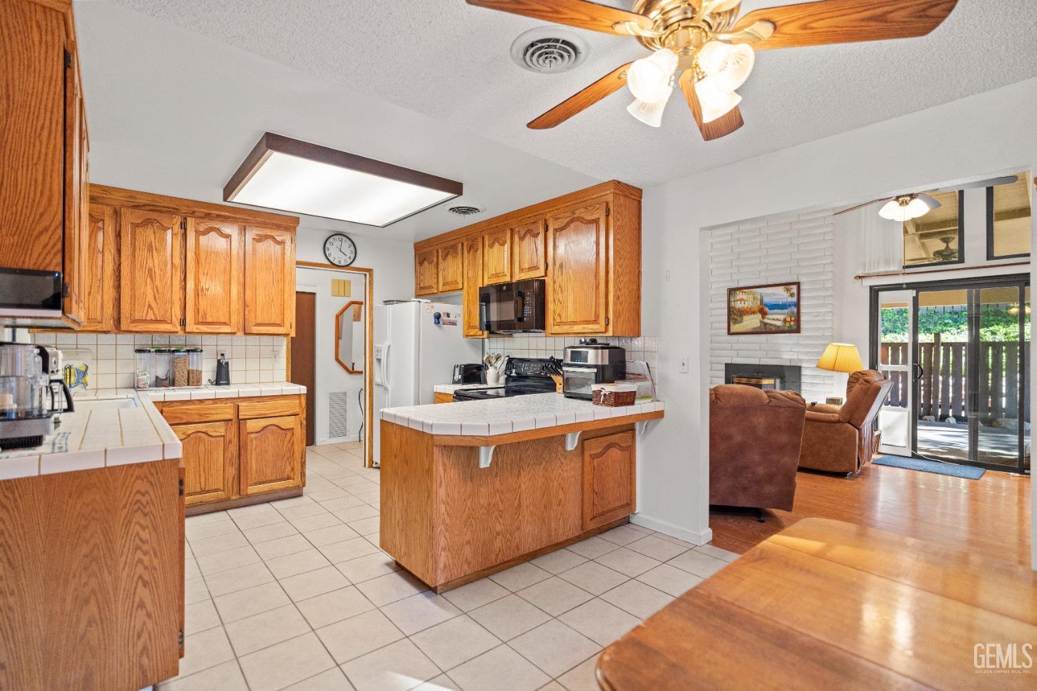 Undisclosed Address Bakersfield, CA 93306 - Photo 19 of 56 a large kitchen with stainless steel appliances granite countertop a stove a sink dishwasher and a refrigerator