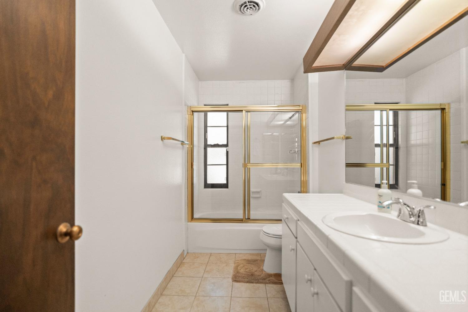 Undisclosed Address Bakersfield, CA 93306 - Photo 27 of 56 a bathroom with a sink a mirror and a bathtub