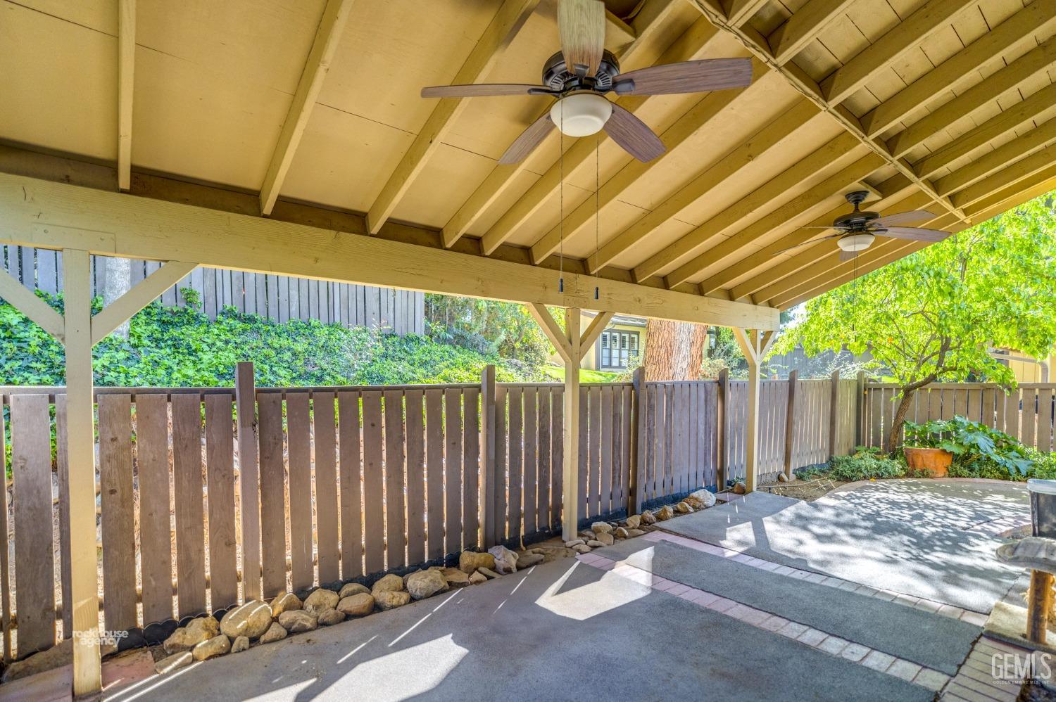 Undisclosed Address Bakersfield, CA 93306 - Photo 34 of 56 a view of a backyard with wooden fence