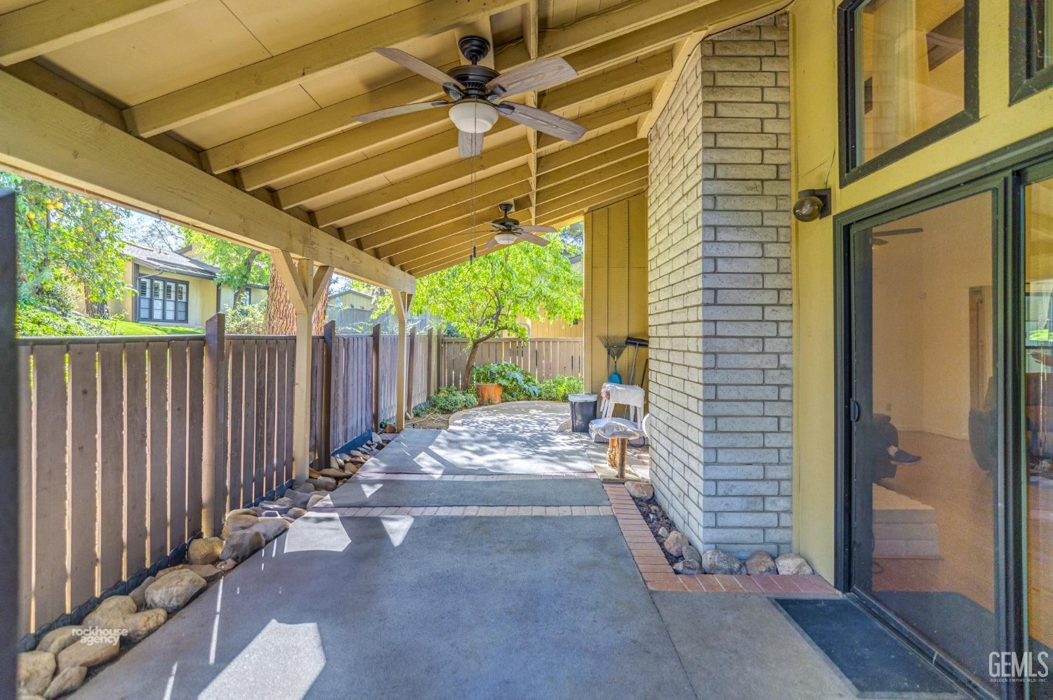Undisclosed Address Bakersfield, CA 93306 - Photo 35 of 56 a view of a backyard with wooden fence and large trees