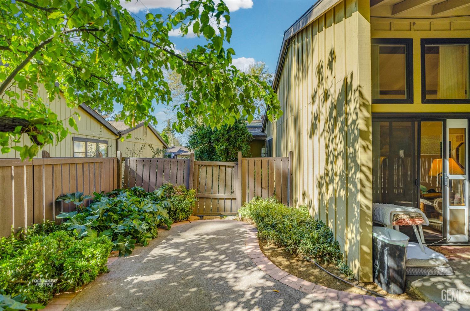 Undisclosed Address Bakersfield, CA 93306 - Photo 38 of 56 a front view of a house with a garden