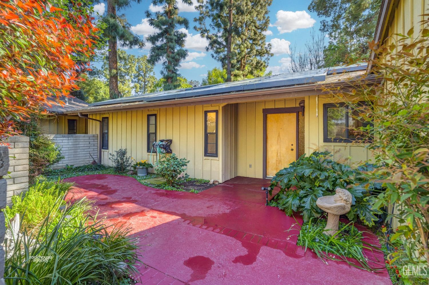 Undisclosed Address Bakersfield, CA 93306 - Photo 4 of 56 a view of a backyard with potted plants