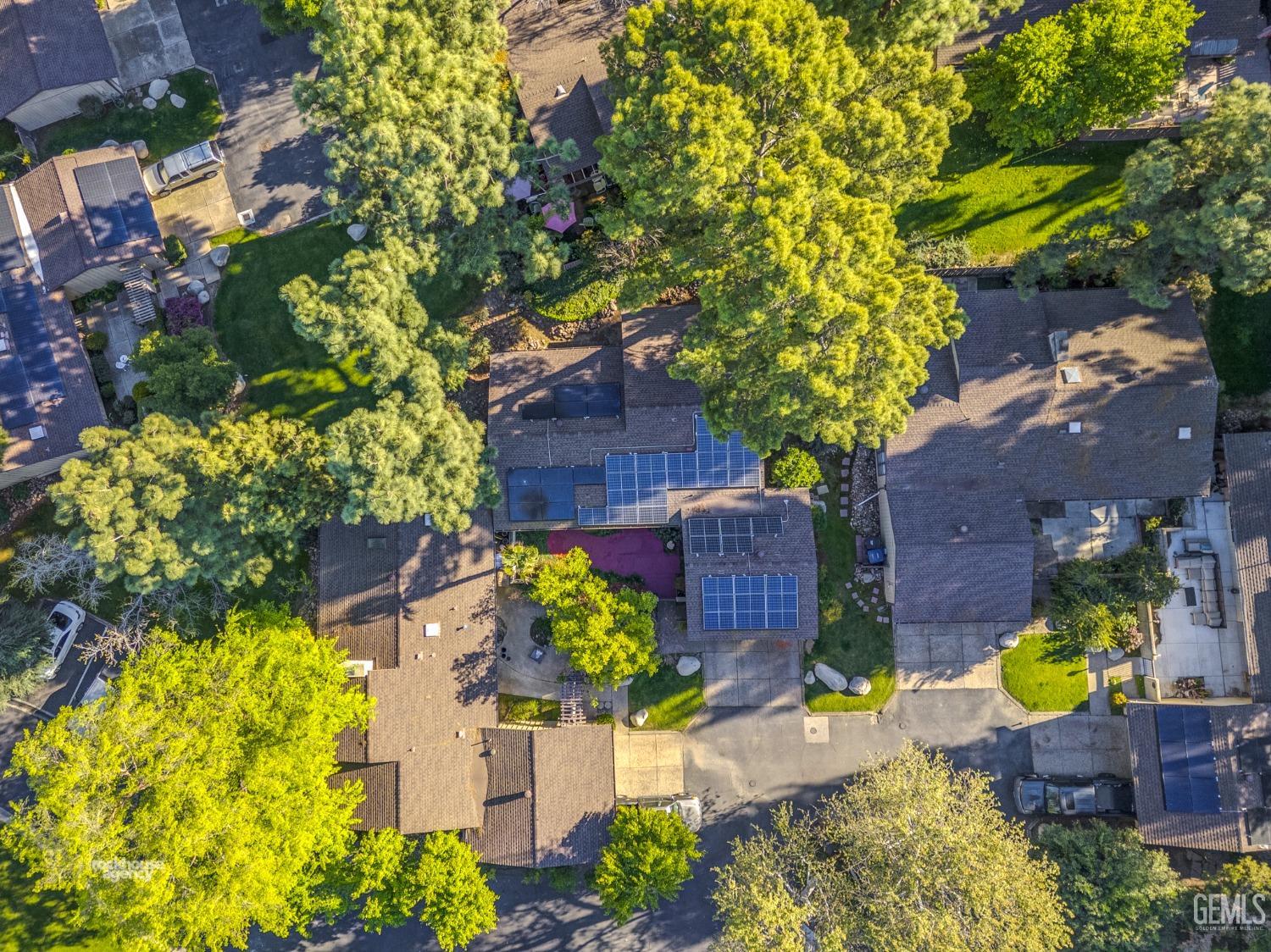 Undisclosed Address Bakersfield, CA 93306 - Photo 42 of 56 front view of a house with a yard and potted plants