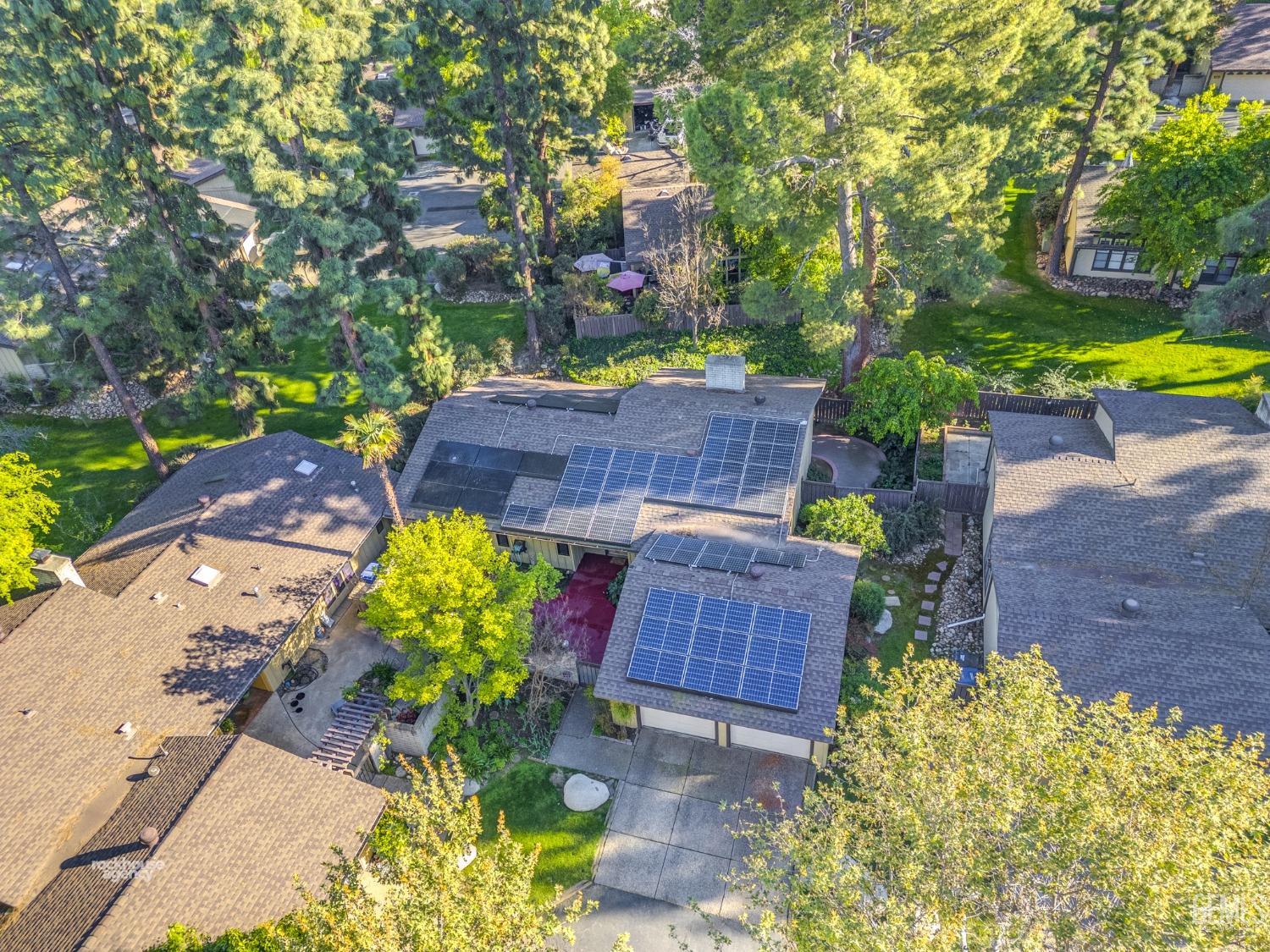 Undisclosed Address Bakersfield, CA 93306 - Photo 44 of 56 a aerial view of a house with a yard and garden