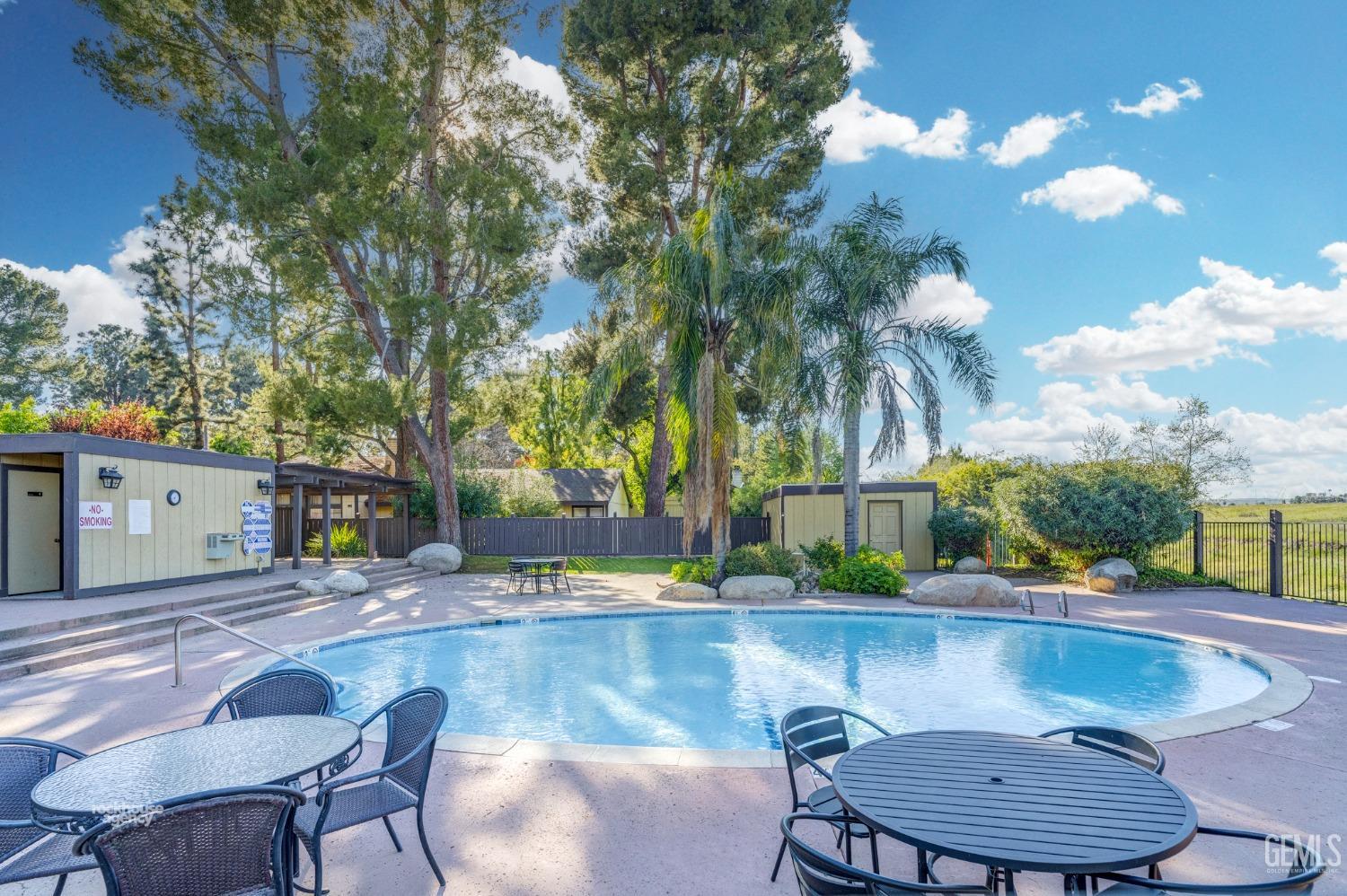 Undisclosed Address Bakersfield, CA 93306 - Photo 46 of 56 a swimming pool with outdoor seating and yard