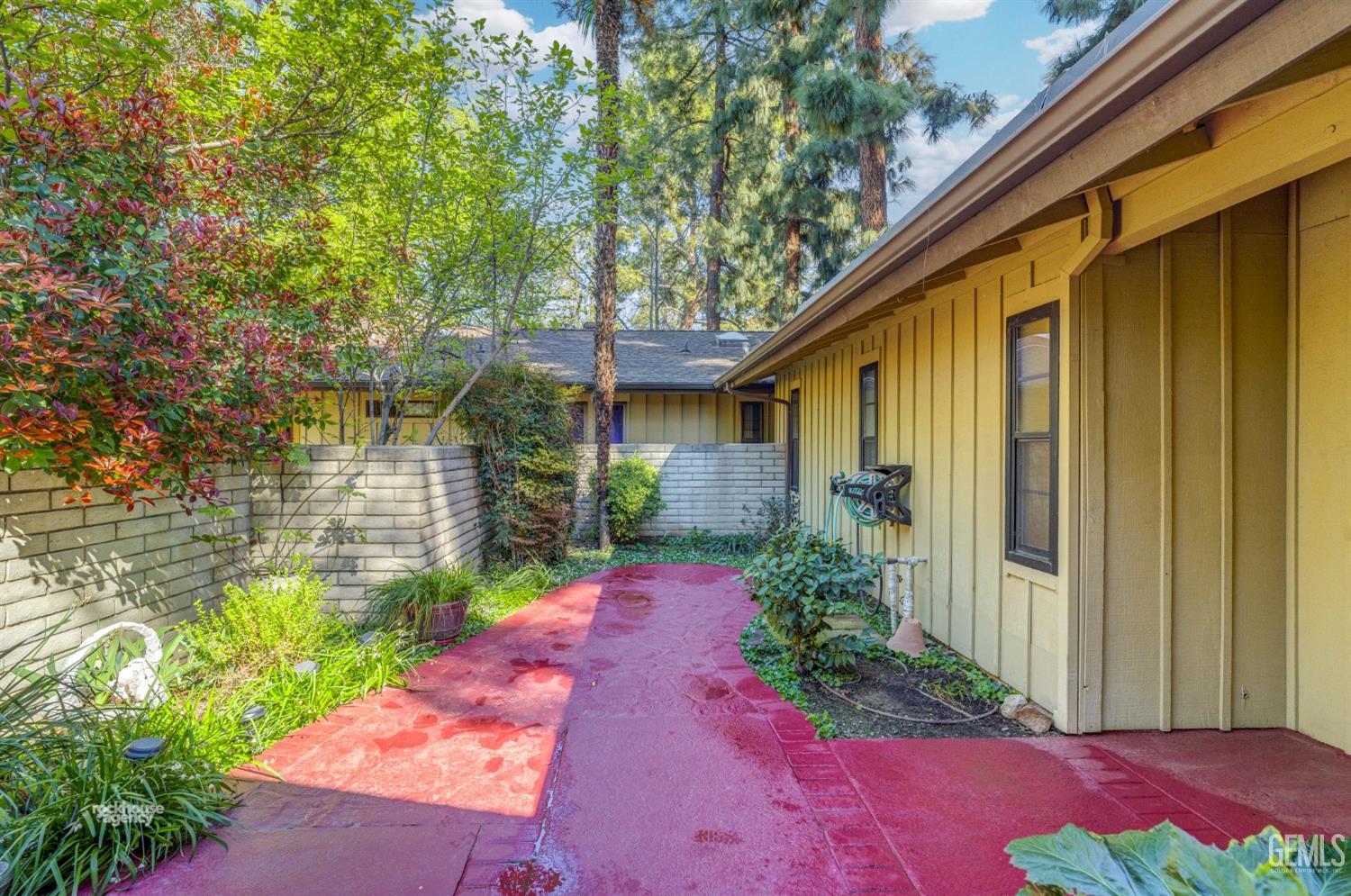 Undisclosed Address Bakersfield, CA 93306 - Photo 5 of 56 a view of a backyard with potted plants
