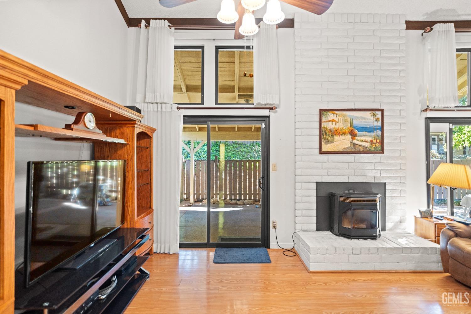 Undisclosed Address Bakersfield, CA 93306 - Photo 10 of 56 a living room with furniture and a fireplace
